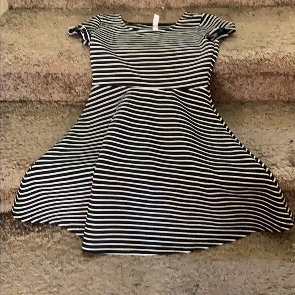 Black dress with white stripes on it
